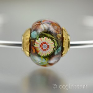 turquoise aqua ivory coral encased murrini bead