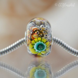 Handmade lampwork encased murrini bead