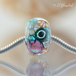 Handmade lampwork encased murrini bead