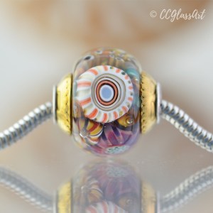 Handmade lampwork encased murrini bead