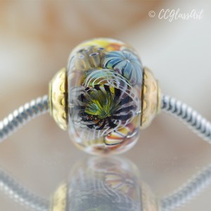 Handmade lampwork encased murrini bead