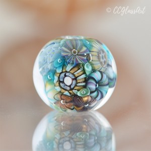 Handmade Lampwork glass art bead with encased murrini