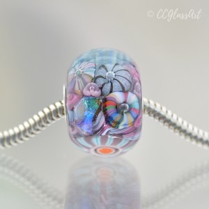 Handmade Lampwork glass art bead with encased murrini