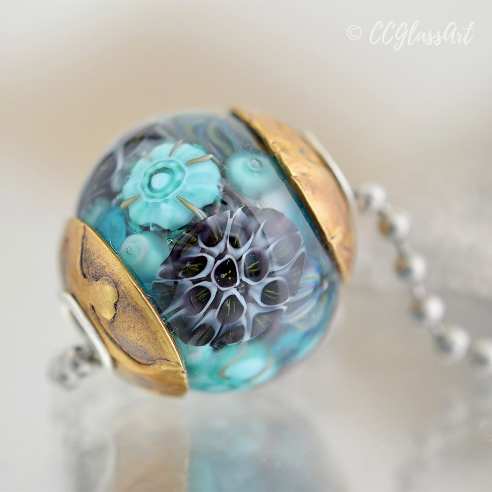 Reef Series encased murrini bead with brass bead caps
